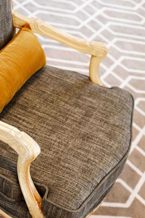 Althoff Hotel Fuerstenhof Целле Экстерьер фото A chair upholstered in tweed